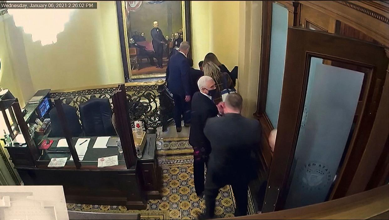 In this image shown Wednesday from a Senate video, a security camera shows Vice President Mike Pence being evacuated as rioters breach the U.S. Capitol (Photo: Senate Television via ASSOCIATED PRESS)