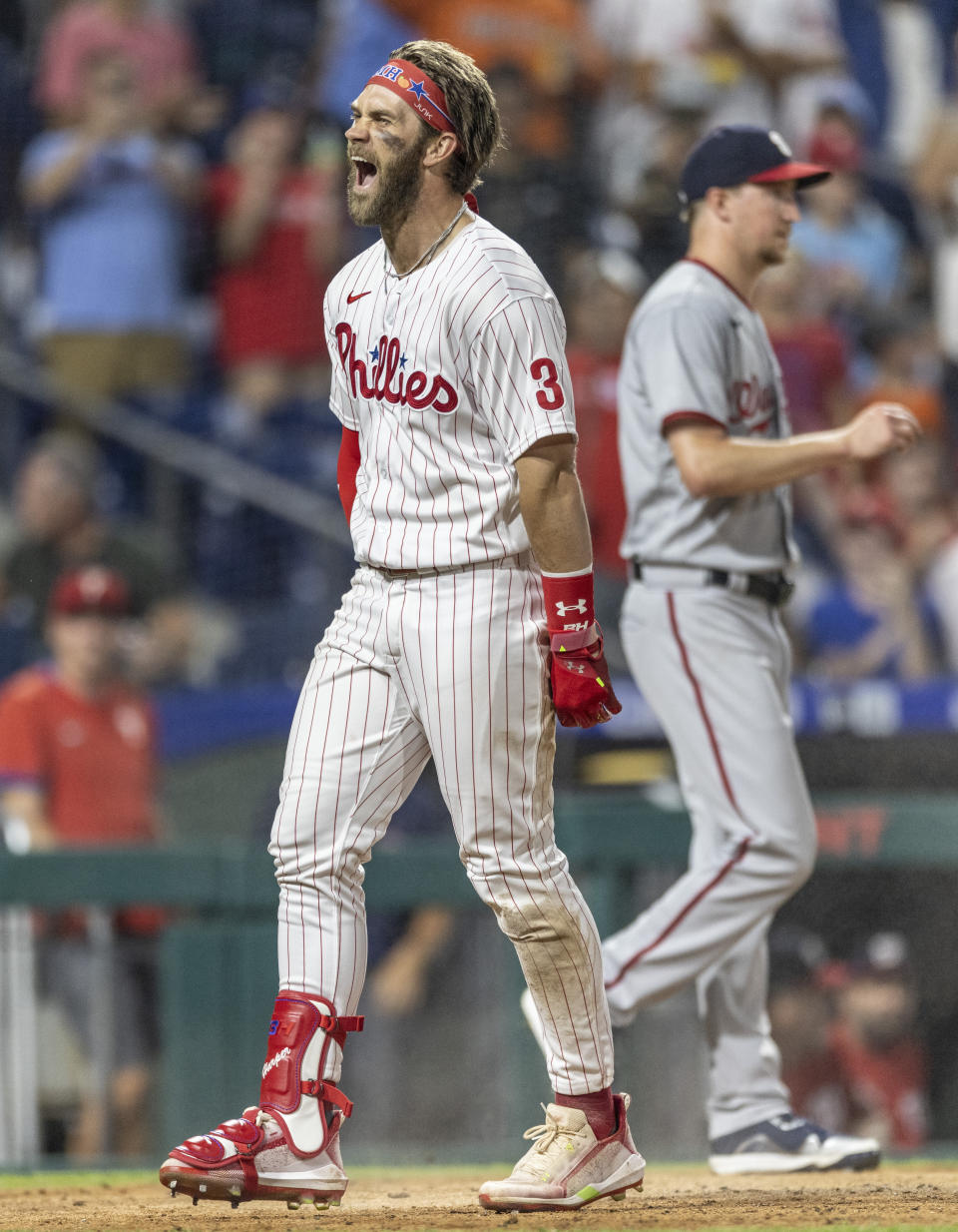 Philadelphia Phillies' Bryce Harper (3) shouts at home plate after hitting an inside-the-park home run during the fifth inning of the team's baseball game against the Washington Nationals, Tuesday, July 27, 2021, in Philadelphia. (AP Photo/Laurence Kesterson)