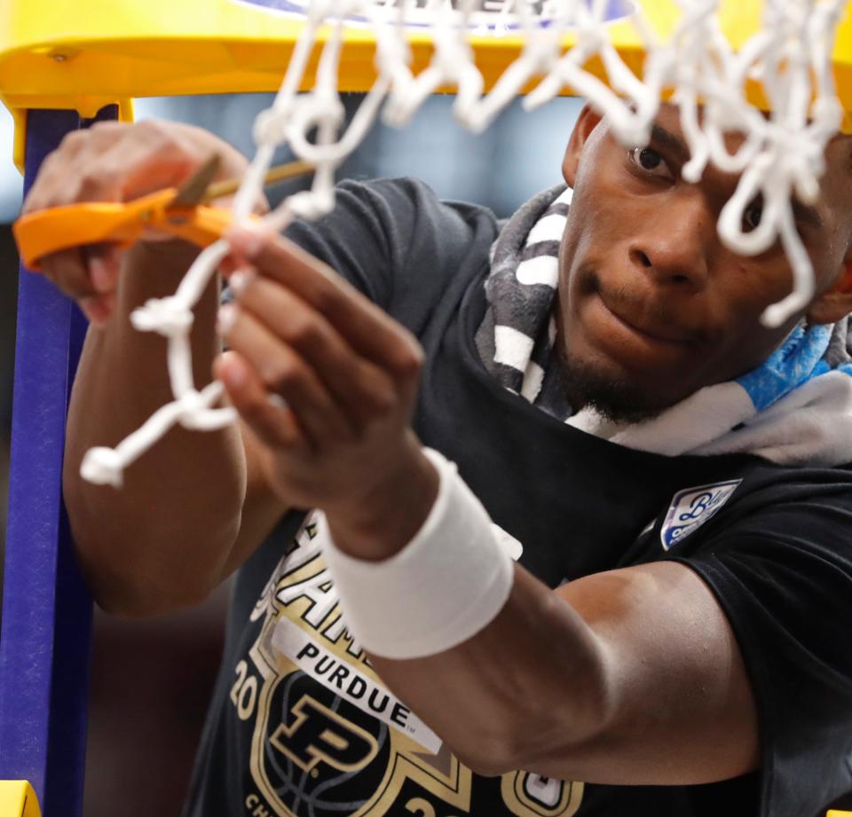 Purdue Boilermakers guard Brandon Newman (5) cuts down the net after winning the Big Ten Men’s Basketball Tournament Championship game against the Penn State Nittany Lions, Sunday, March 12, 2023, at United Center in Chicago. Purdue won 67-65.