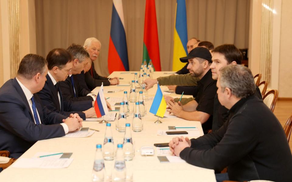 Talks in Belarus were underway with the Russian delegation on the left and the Ukrainian representatives on the right - Sergei Kholodilin/BeITA/Handout/EPA-EFE/Shutterstock