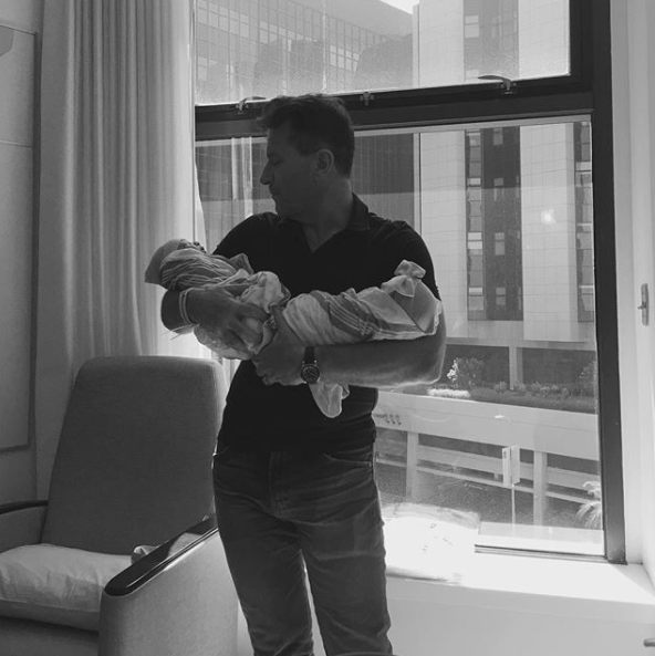 Robert Herjavec enjoys some time with the newborns. Source: Instagram/kymherjavec5678