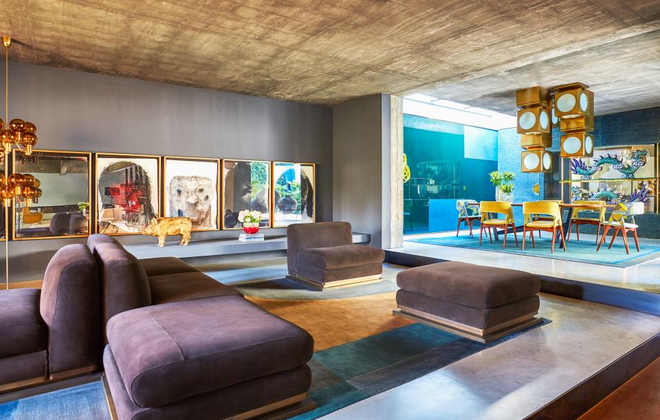 In the lounge area of the living room, De Cotiis designed the custom suede seating on brass bases. Alessandro Verdi charcoal works on paper; custom rug by De Cotiis.