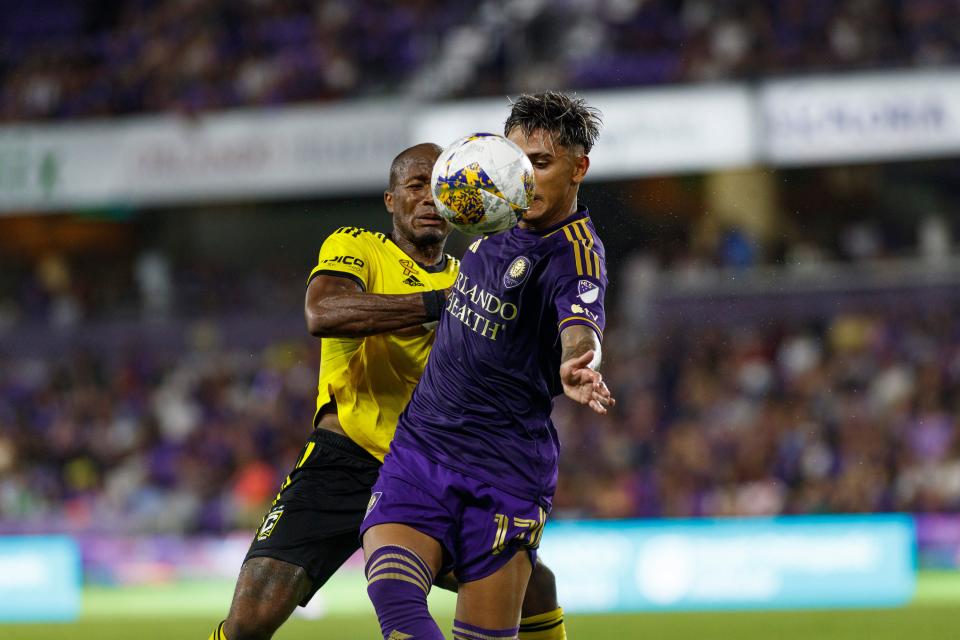 Orlando midfielder Facundo Torres (17) and Crew midfielder Darlington Nagbe battle for the ball on Sept. 16.