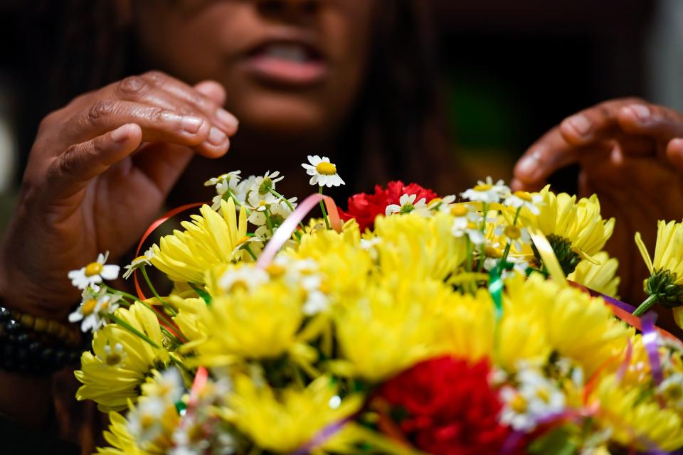 Nikeema Lee, owner of Mahaba Floristry, arranges a celebration bouquet in her work space on Tuesday, Jan. 10, 2023. 