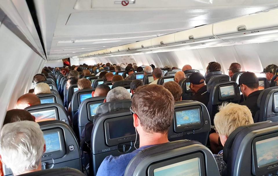 One passenger took umbrage with Qantas over the packed flight, sharing this image to social media. Source: Twitter 