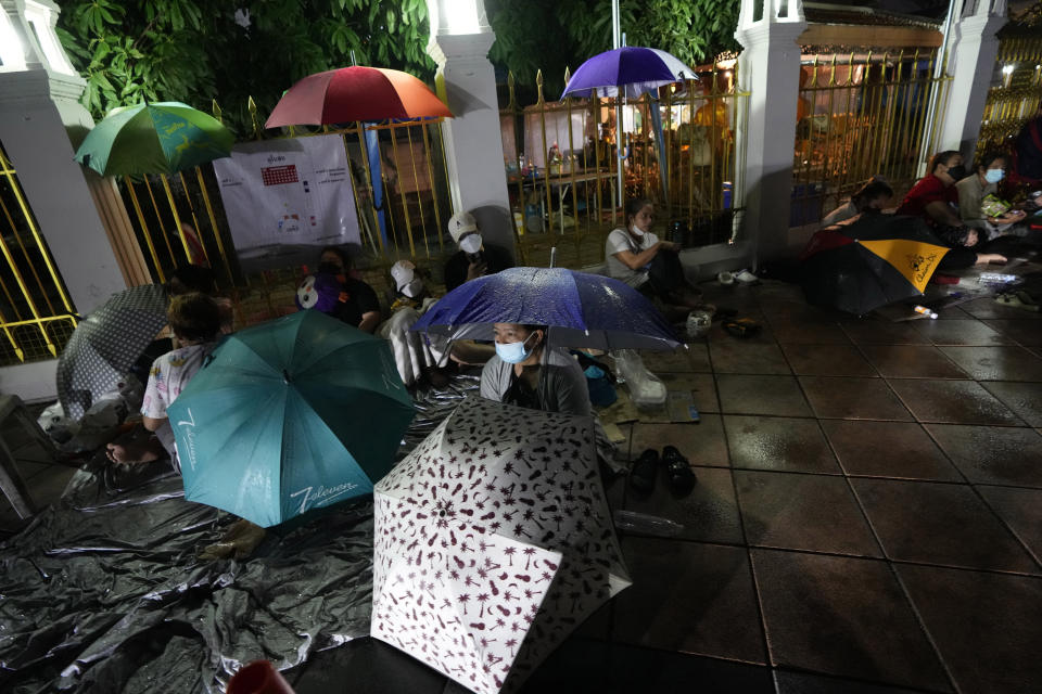 Locals wait in line overnight for free coronavirus testing at Wat Phra Si Mahathat temple in Bangkok, Thailand, Friday, July 9, 2021. Faced with rapidly rising numbers of new coronavirus infections and growing concern over the proliferation of the highly contagious delta variant, major Asia-Pacific cities implemented new restrictions Friday in the hope of reversing the trend before health care systems are overwhelmed. (AP Photo/Sakchai Lalit)