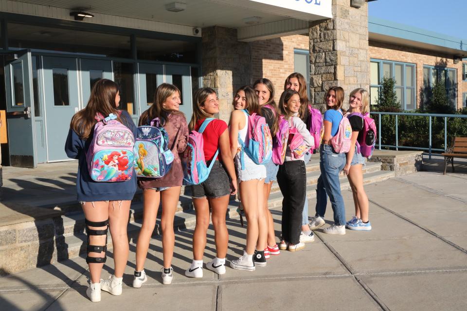 Returning students at Westlake High School in Thornwood, show off their backpacks on the first day of school, Sept. 1, 2022. 