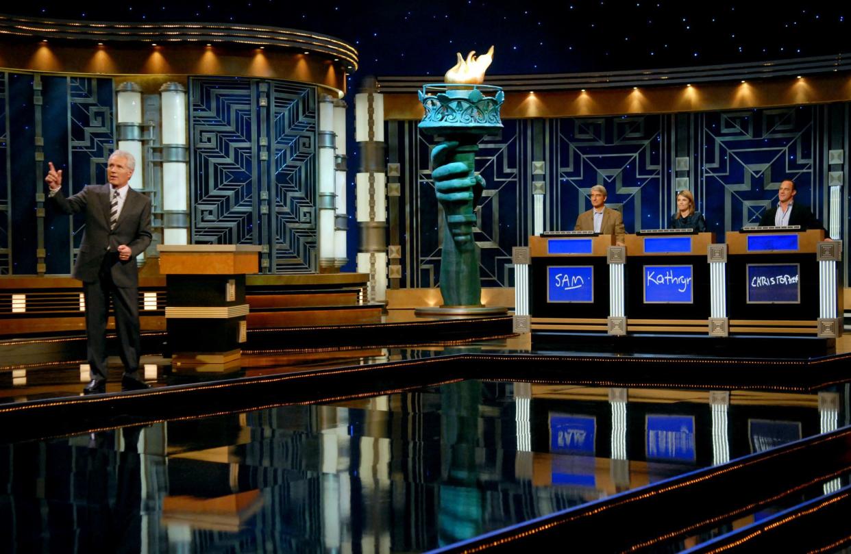 Alex Trebek hosts Jeopardy with guests (l-r) Sam Waterston of "Law & Order," actress Kathryn Erbe of "Law & Order: Criminal Intent" and actor Christopher Meloni of "Law & Order: SVU" during a taping of "Celebrity Jeopardy!" to celebrate the 5000th episode at Radio City Music Hall on Oct. 5, 2006 in New York. "Celebrity Jeopardy!" showcased 30 stars competing for $1,000,000 dollars for charity.