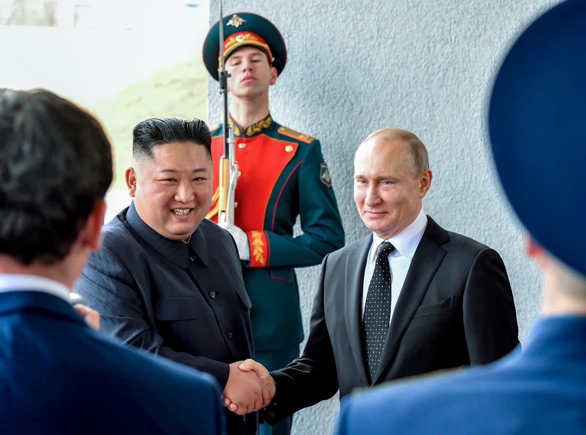 North Korea’s leader Kim Jong-un and Russian president Vladimir Putin shake hands during a meeting in 2019  (AP)