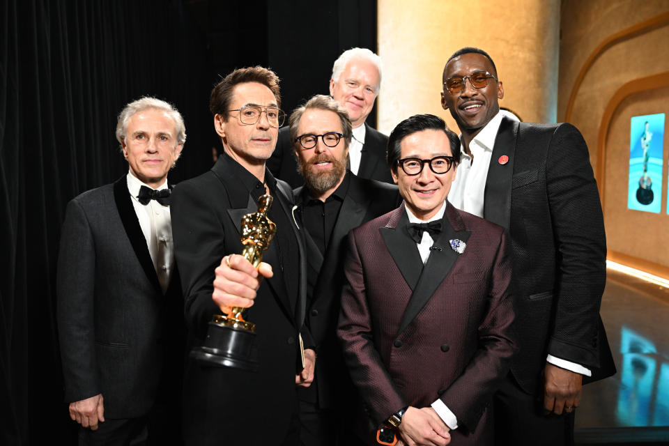 From left: Christoph Waltz, Robert Downey Jr., Ke Huy Quan, Tim Robbins, Sam Rockwell and Mahershala Ali backstage after Best Supporting Actor presentation (Getty Images)