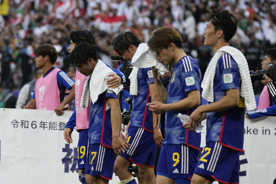 Japanese players react after the Asian Cup Group C soccer match between Iraq and Japan at the Education City Stadium in Al Rayyan, Qatar, Friday, Jan. 19, 2024. Iraq won 2-1. (AP Photo/Aijaz Rahi)