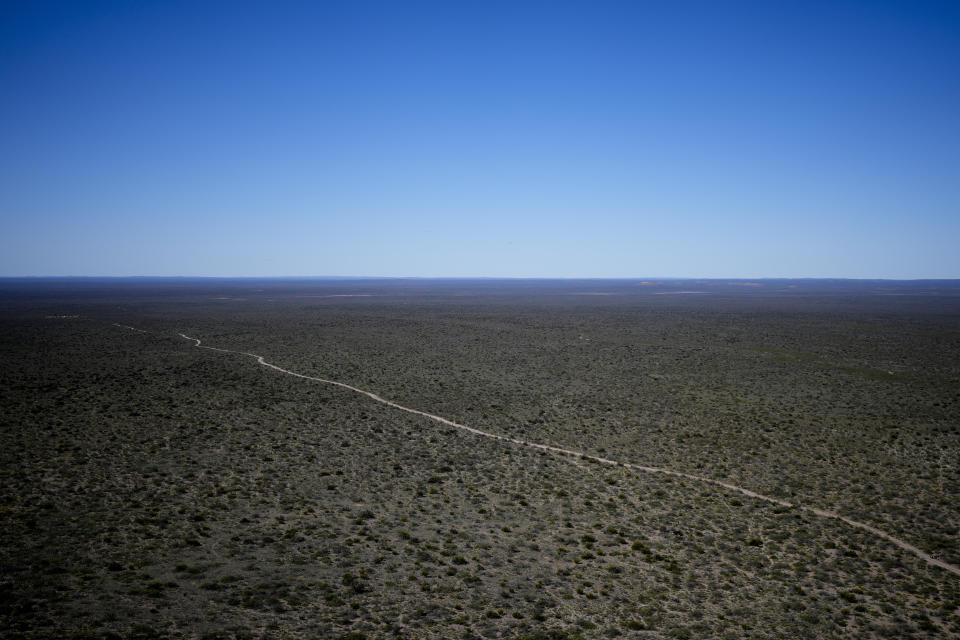 A road crosses the Sierra Paileman, where the Andean Condor Conservation Program is located in the Rio Negro province of Argentina, Thursday, Oct. 13, 2022. For 30 years the program has hatched chicks in captivity, rehabilitated others and freed them across South America. (AP Photo/Natacha Pisarenko)