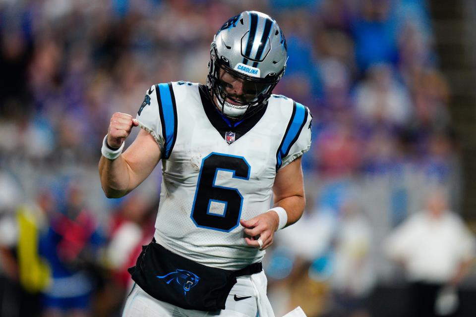 Carolina Panthers quarterback Baker Mayfield celebrates after throwing a touchdown pass against the Buffalo Bills during the first half of an NFL preseason football game on Friday, Aug. 26, 2022, in Charlotte, N.C. (AP Photo/Jacob Kupferman)