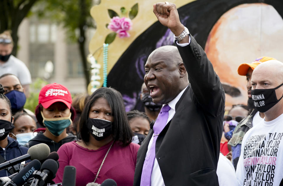 FILE - In this Sept. 25, 2020, file photo,Breonna Taylor family attorney Ben Crump, center speaks during a news conference in Louisville, Ky. Hours of material in the grand jury proceedings for Taylor’s fatal shooting by police have been made public on Friday, Oct. 2. (AP Photo/Darron Cummings, File)