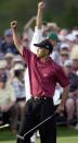 <p>Tiger Woods reacts on the 18th hole after winning the 2001 Masters at the Augusta National Golf Club in Augusta, Ga., Sunday, April 8, 2001. Woods captured this second Masters title, defeating David Duval by two strokes. (AP Photo/Dave Martin) </p>