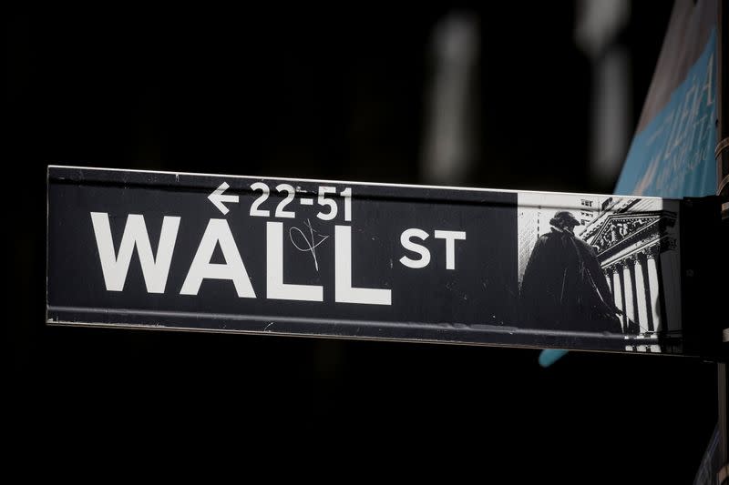 The Wall St. sign is seen near the NYSE in New York