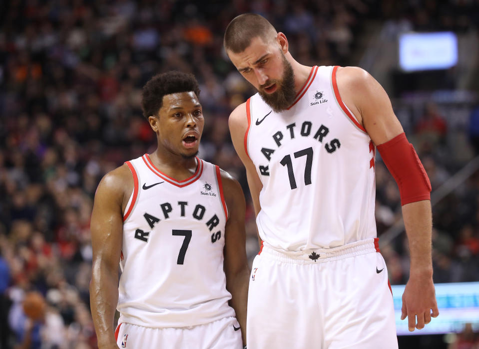 TORONTO, ON - JANUARY 17: Kyle Lowry #7 of the Toronto Raptors talks to Jonas Valanciunas #17 against the Detroit Pistons at Air Canada Centre on January 17, 2018 in Toronto, Canada. NOTE TO USER: User expressly acknowledges and agrees that, by downloading and or using this photograph, User is consenting to the terms and conditions of the Getty Images License Agreement. (Photo by Tom Szczerbowski/Getty Images)