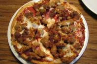 <div class="caption-credit"> Photo by: Credit: flickr/ Matt McGee</div><br> 3) Pizza Hut <br> <b>Meaty P'Zone</b> <br> Fat: 46 grams <br> Calories: 1,100 <br> Sodium: 2,740 milligrams <br> <br> <b>Meat Lover's Personal 6-Inch Pan Pizza (left)</b> <br> Fat: 46 grams <br> Calories: 830 <br> Sodium: 2,110 milligrams <br> <br> <b>Meat Lover's 14-Inch Pan Pizza (1 slice)</b> <br> Fat: 28 grams <br> Calories: 480 <br> Sodium: 1,180 milligrams <br>