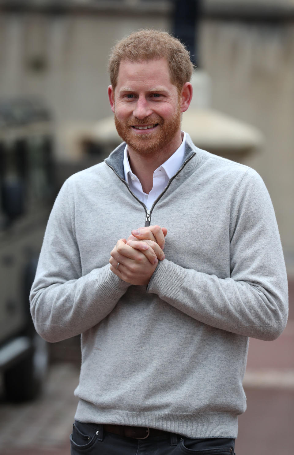 Prince Harry clapping his hands and smiling