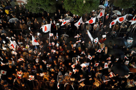 Supporters of the Liberal Democratic Party wait for the arrival of Japan's Prime Minister Shinzo Abe, leader of the party, at an election campaign rally in Tokyo, Japan October 21, 2017. REUTERS/Kim Kyung-Hoon