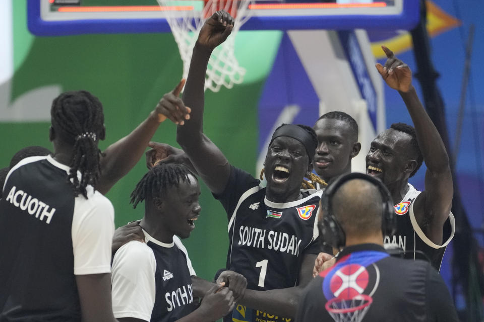 South Sudan team celebrates after winning against Angola during their Basketball World Cup classification match at the Araneta Coliseum, Manila, Philippines on Saturday Sept. 2, 2023. (AP Photo/Aaron Favila)