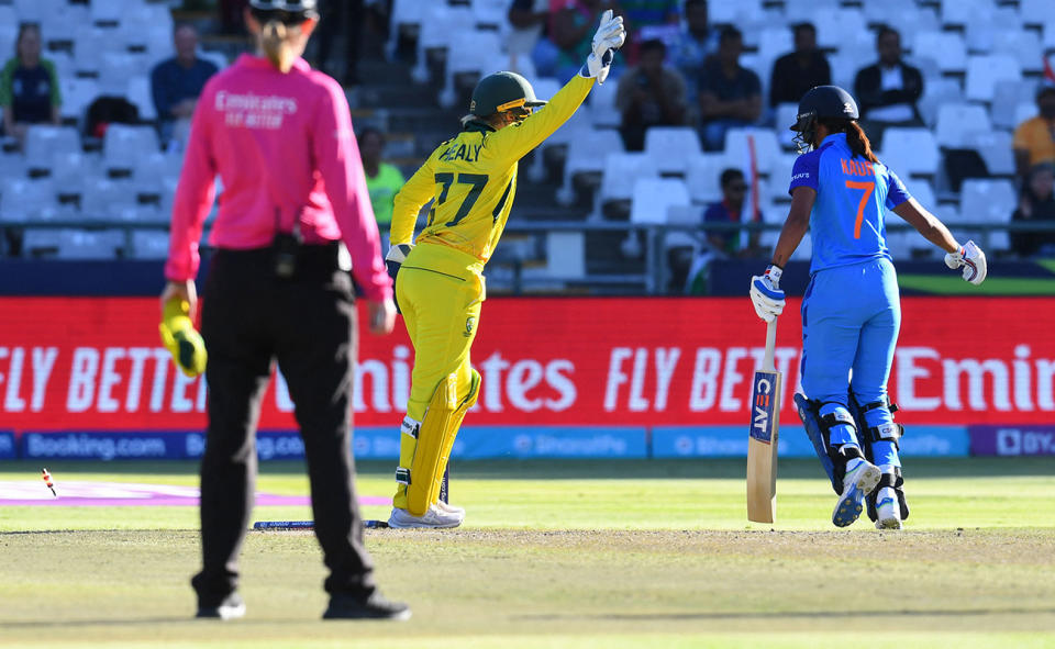 Alyssa Healy celebrates after running out Harmanpreet Kaur in the T20 World Cup semi-final. (Photo by RODGER BOSCH/AFP via Getty Images)