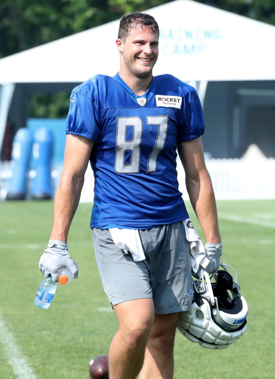 Lions tight end Sam LaPorta walks off the field after training camp on Wednesday, July 26, 2023, in Allen Park.