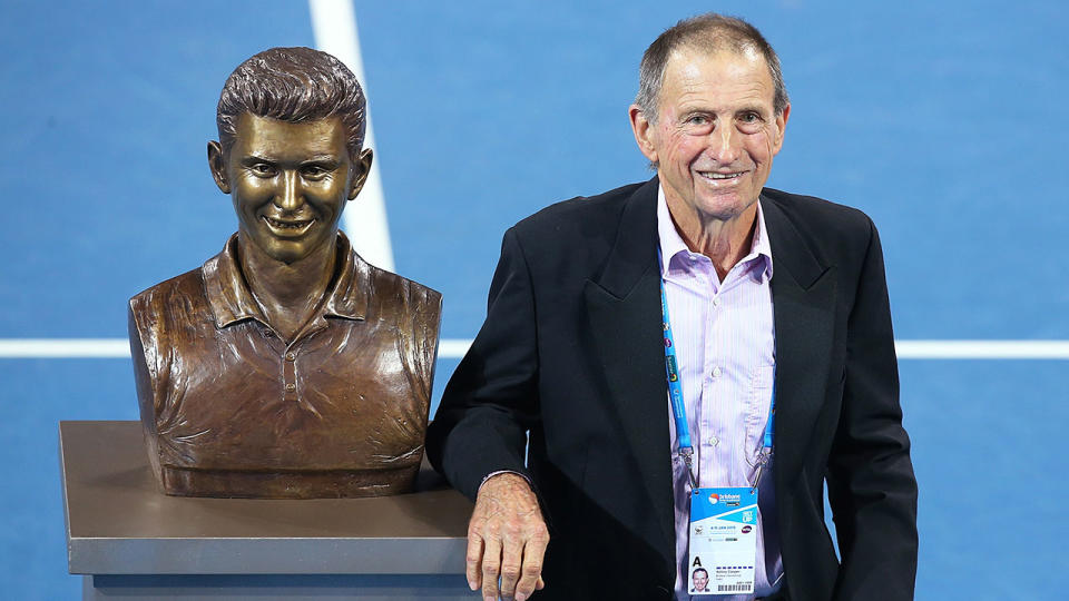 Seen here, Aussie tennis great Ashley Cooper standing next to his statue.