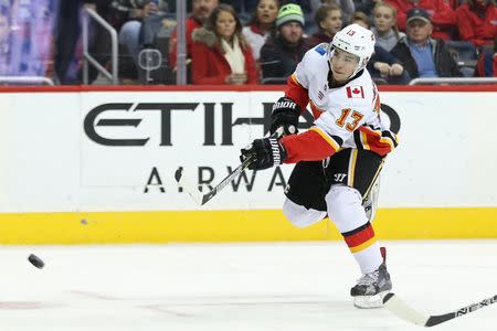 Nov 20, 2017; Washington, DC, USA; Calgary Flames left wing Johnny Gaudreau (13) scores a goal against the Washington Capitals in the first period at Capital One Arena. Geoff Burke-USA TODAY Sports