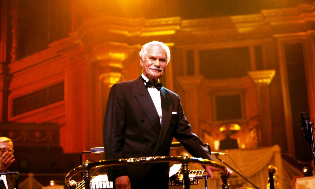 <span>Laurie Johnson conducting at the Royal Festival Hall in London, 1999.</span><span>Photograph: Roberta Parkin/Redferns</span>