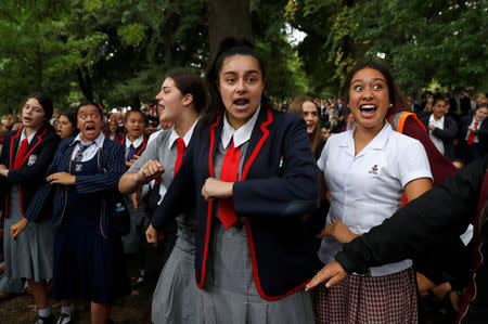 FILE PHOTO: Students perform the Haka as they gather in a vigil to commemorate victims of Friday's shooting, outside Masjid Al Noor mosque in Christchurch, New Zealand March 18, 2019. REUTERS/Jorge Silva/File Photo