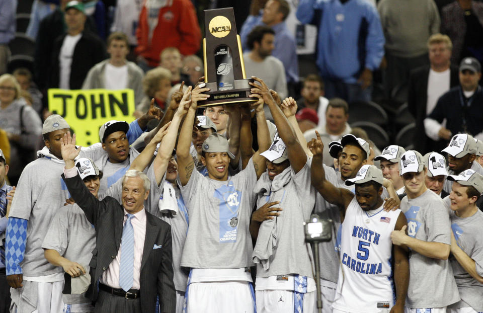 Apr 6, 2009; Detroit, MI, USA; Members of the North Carolina Tar Heels hoist the national championship trophy after defeating the Michigan State Spartans 89-72 in the championship game of the Final Four in the 2009 NCAA mens basketball tournament at Ford Field. Mandatory Credit: Bob Donnan-USA TODAY Sports