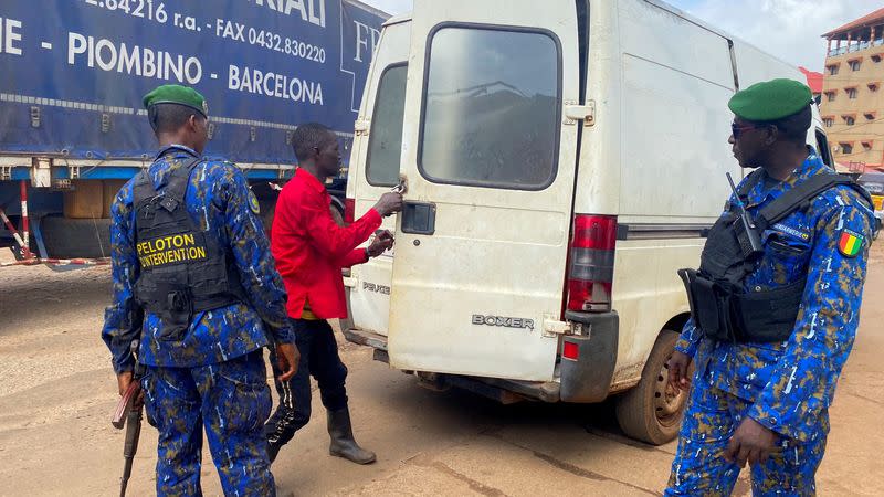 Guinean security forces patrol on the streets after armed men spring Guinea's ex-junta leader Moussa Dadis Camara out of prison in Conakry