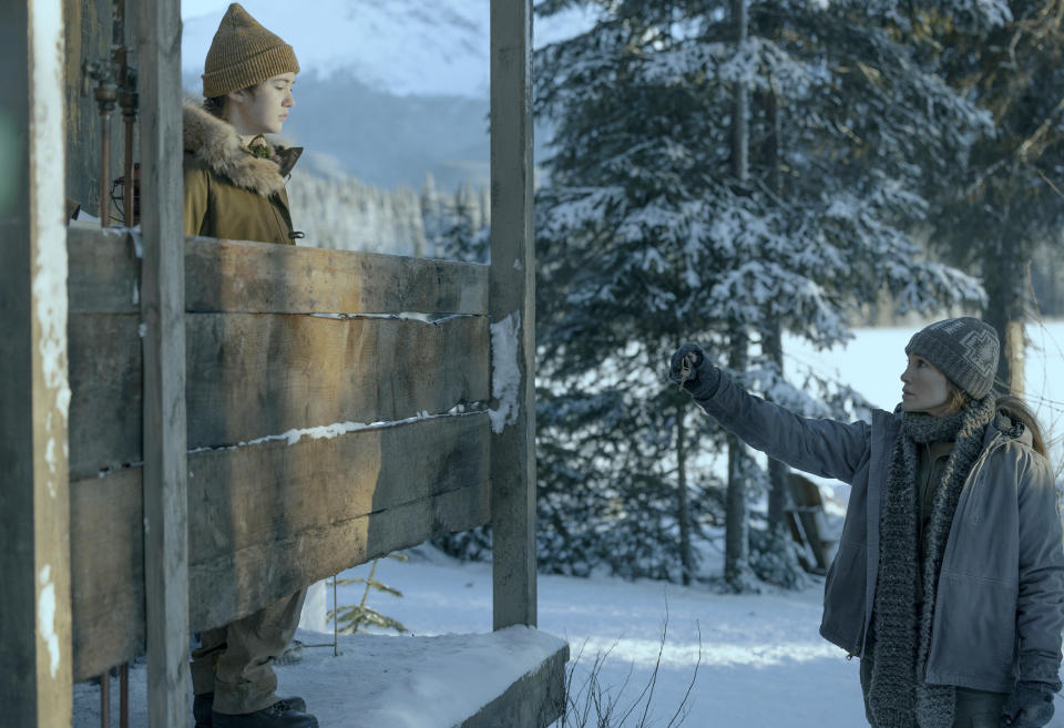 This image released by Netflix shows Lucy Paez, left, and Jennifer Lopez in a scene from "The Mother." (Ana Carballosa/Netflix via AP)