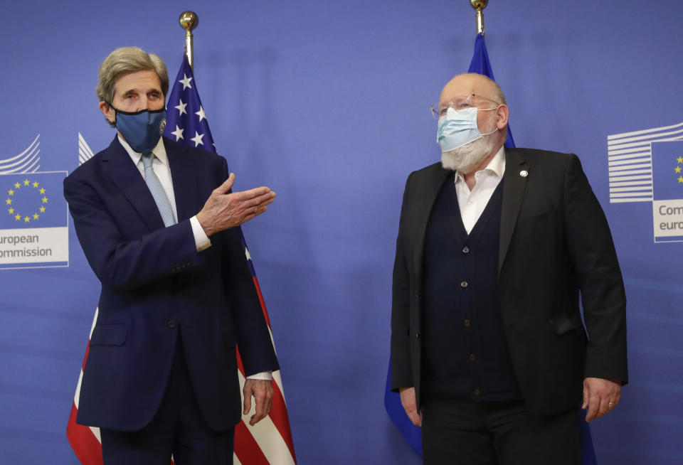 European Commissioner for European Green Deal Frans Timmermans, right, and U.S Special Presidential Envoy for Climate John Kerry address a media conference at EU headquarters in Brussels, Tuesday, March 9, 2021. US special envoy for climate John Kerry traveled to Brussels Tuesday to discuss trans-Atlantic cooperation with European officials in the wake of President Joe Biden's decision to rejoin the global effort to curb climate change. (Olivier Hoslet, Pool via AP)