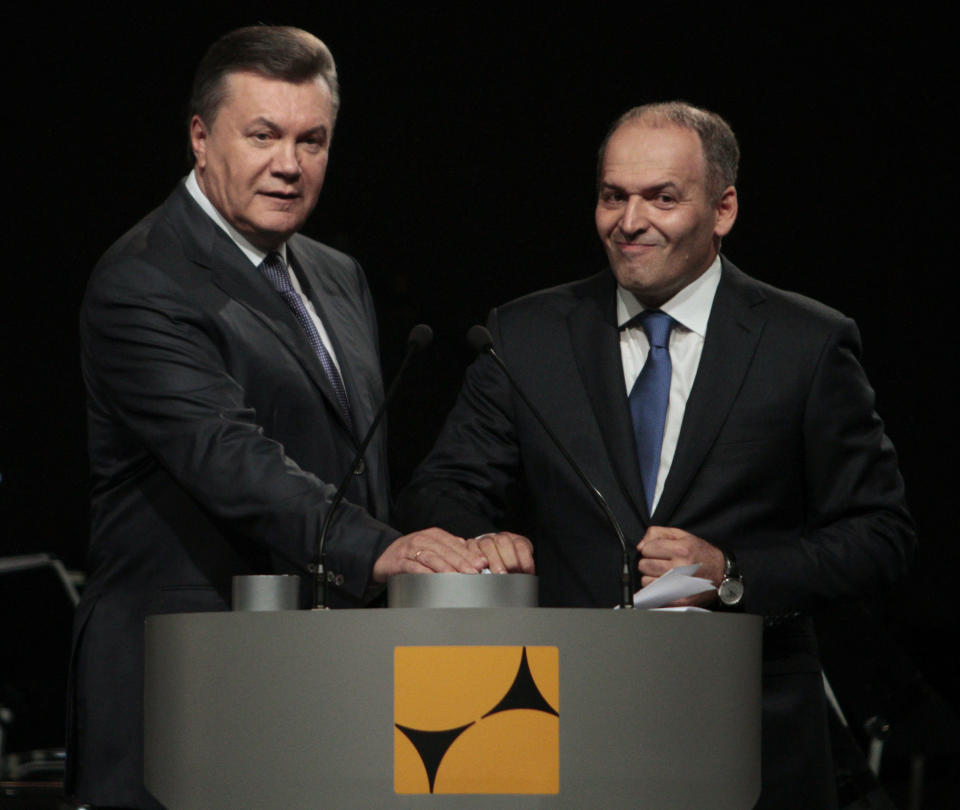 Ukraine's former president Viktor Yanukovych and tycoon Viktor Pinchuk take part in a ceremony to open a new steel mill on Oct. 4, 2012. (Photo: Anatolii Stepanov / Reuters)