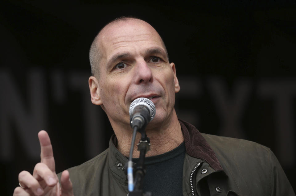 Former Greek economist politician Yanis Varoufakis speaks to crowds gathered at Parliament Square in London, protesting against the imprisonment and extradition of Wikileaks founder Julian Assange extradition, Saturday Feb. 22, 2020. (Isabel Infantes/PA via AP)