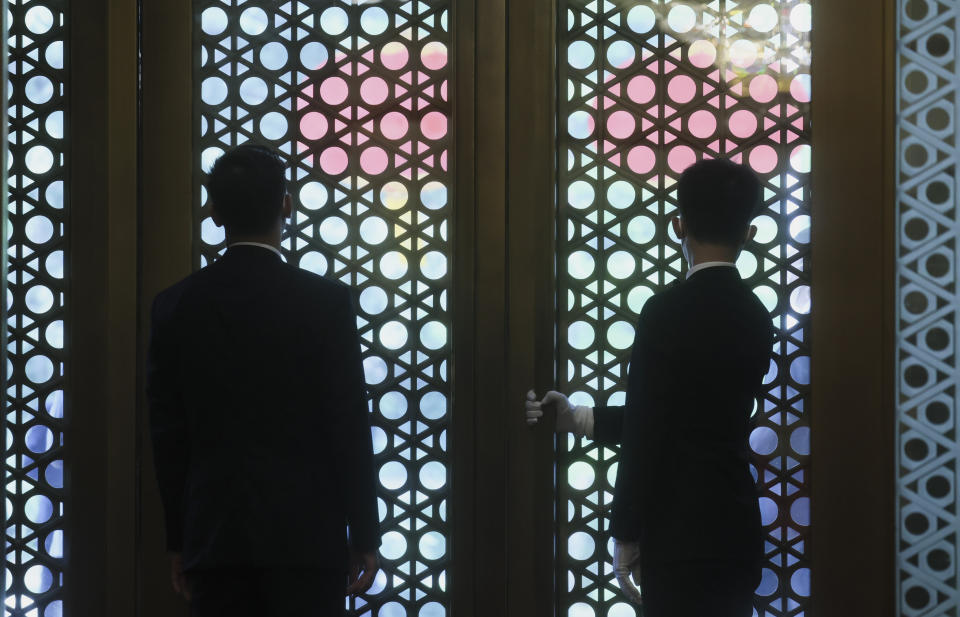 Doormen await the arrival of U.S. Secretary of State Antony Blinken, ahead of his meeting with China's Foreign Minister Qin Gang, at the Diaoyutai State Guesthouse in Beijing, China, Sunday, June 18, 2023. (Leah Millis/Pool Photo via AP)