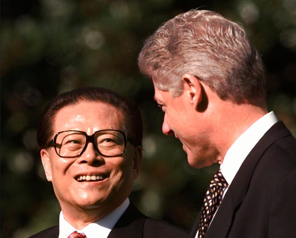 Jiang Zemin with President Bill Clinton on the South Lawn of the White House during a state arrival ceremony for the Chinese president, Oct 1997 - AP Photo/Wilfredo Lee
