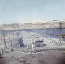 FILE - In this April 1964 file photo, a truck enters a tunnel during construction of the Aswan High Dam over the river Nile in Egypt. Egyptians are marking 50 years since the inauguration of the Nile dam, a massive feat of construction that has shaped the course of modern-day Egypt. It spared it from seasonal droughts and flooding, and generated electricity. (AP Photo, File)