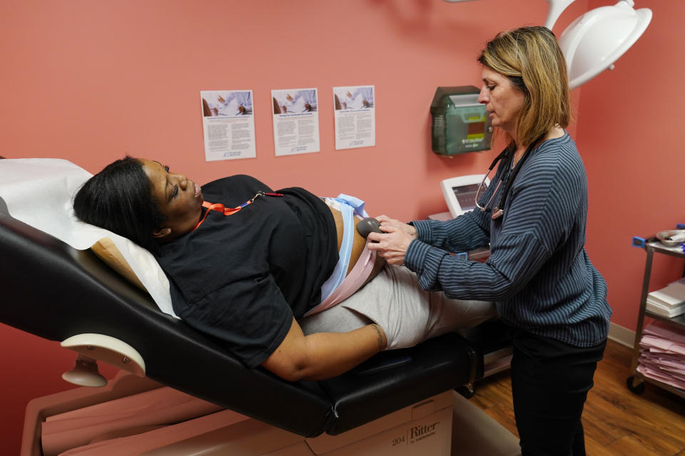Dr. Michele Urban, M.D., cares for Tamara Spates, of Salisbury, Md., during a prenatal visit at a Chesapeake Health Care office in Salisbury, Md., Thursday, March 2, 2023. (AP Photo/Susan Walsh)