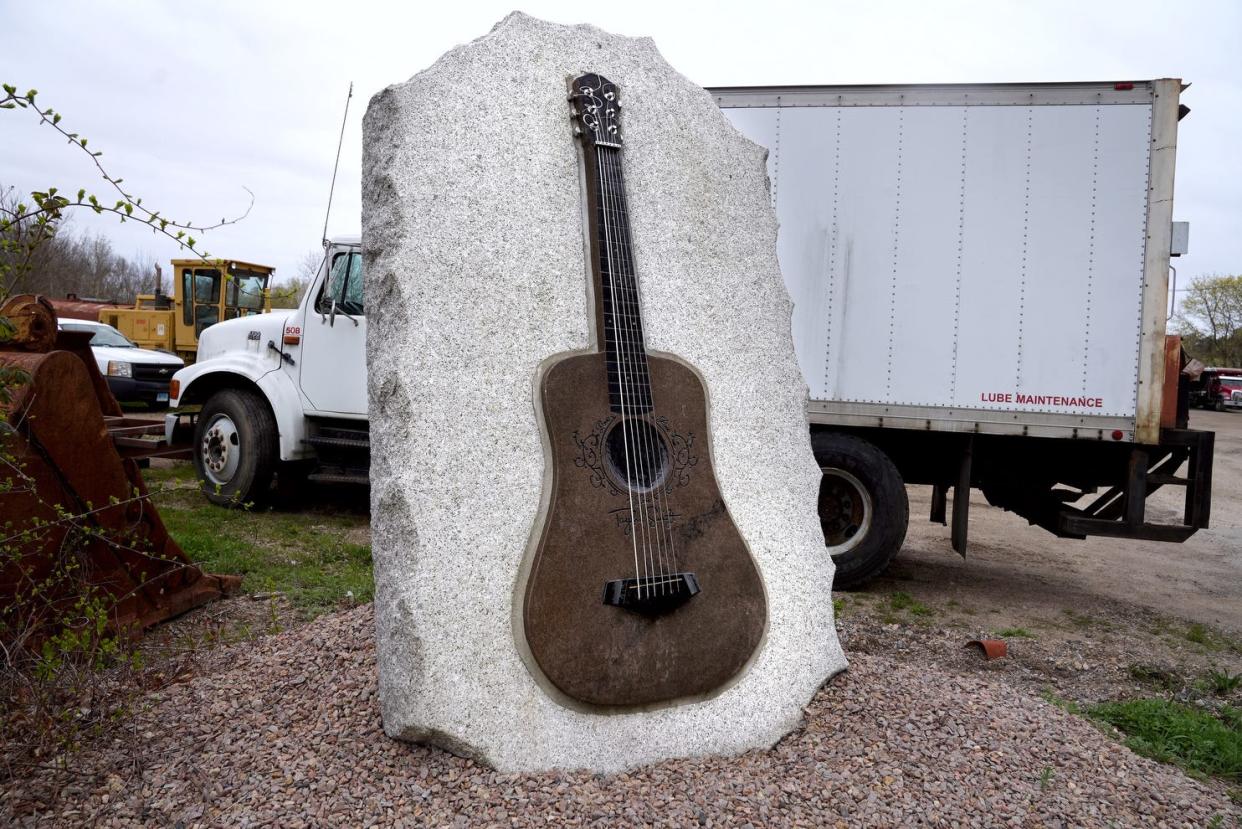 The 2-ton guitar tribute built for Taylor Swift stands in the parking lot of Cherenzia Excavation.