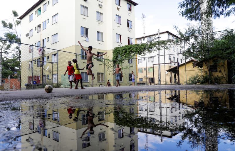 Kids play soccer in the Cidade de Deus slum during the coronavirus disease (COVID-19) outbreak in Rio de Janeiro