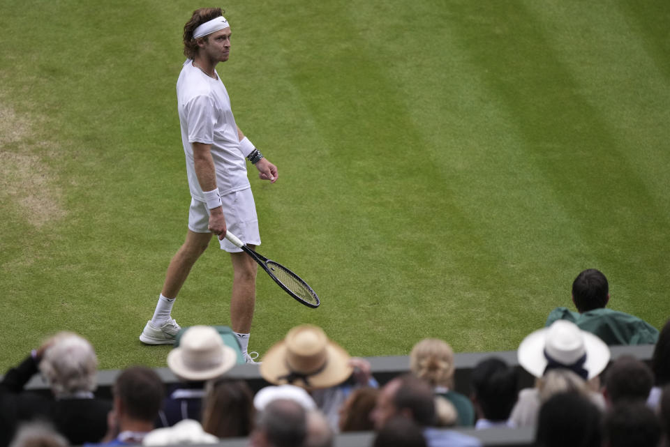 Russia's Andrey Rublev looks around at the crowd as he plays Serbia's Novak Djokovic in a men's singles match on day nine of the Wimbledon tennis championships in London, Tuesday, July 11, 2023. (AP Photo/Alberto Pezzali)