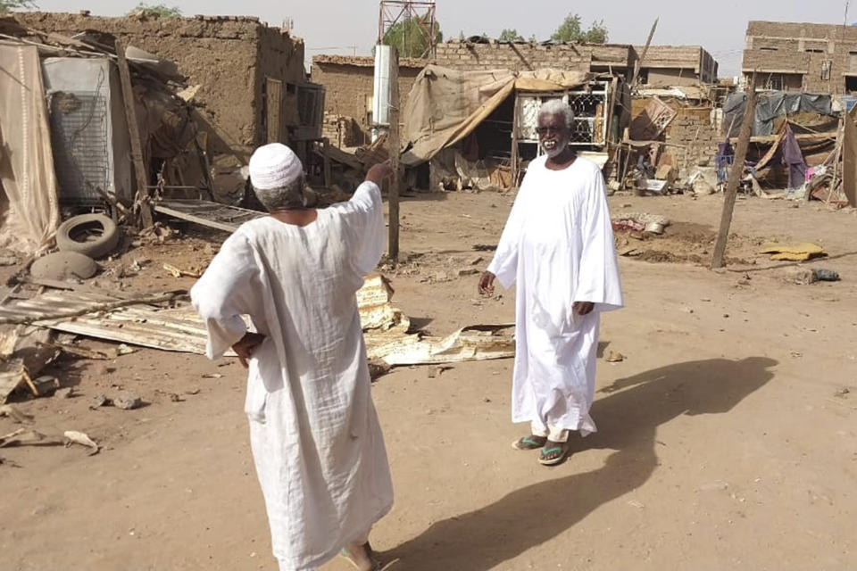 People check the rubble of their destroyed home after strikes at Allamat district in Khartoum, Sudan, Thursday, June 1, 2023. The White House says it's imposing sanctions against key defense companies and people who “perpetuate violence” in Sudan as the warring sides fail to abide by a cease-fire agreement in the northeastern African nation. (AP Photo)