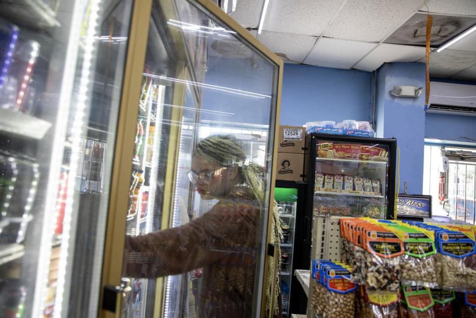 Isabella Morningstar stops at a convenience store to buy food on the morning of Nov. 21, 2023. Without a job, she relies on food stamps to get groceries.