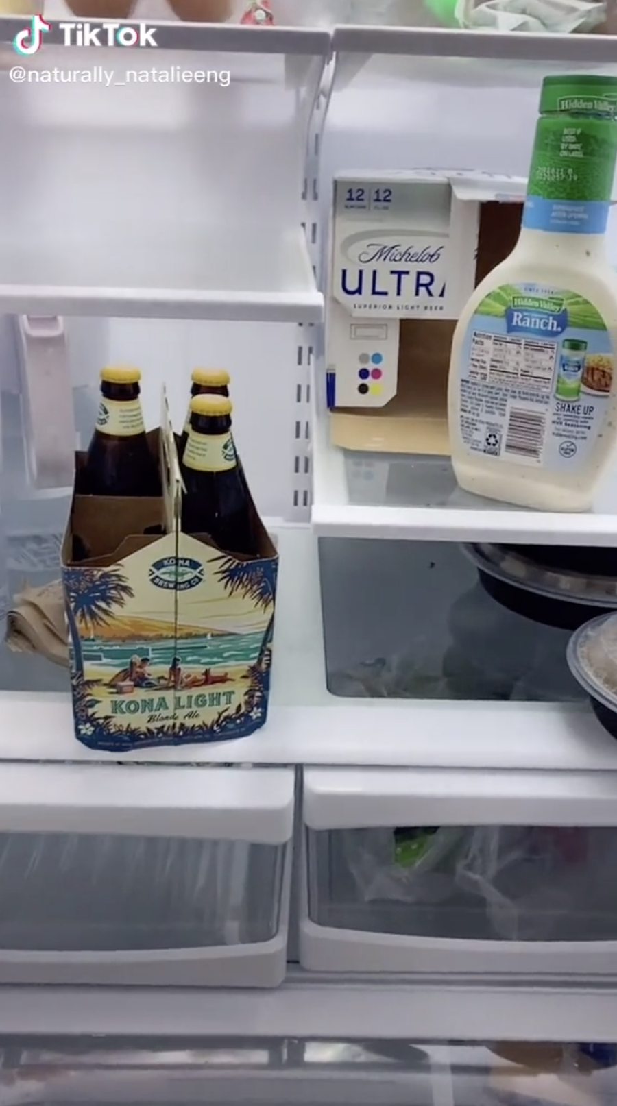 Image of a fridge with just beer and Ranch dressing.