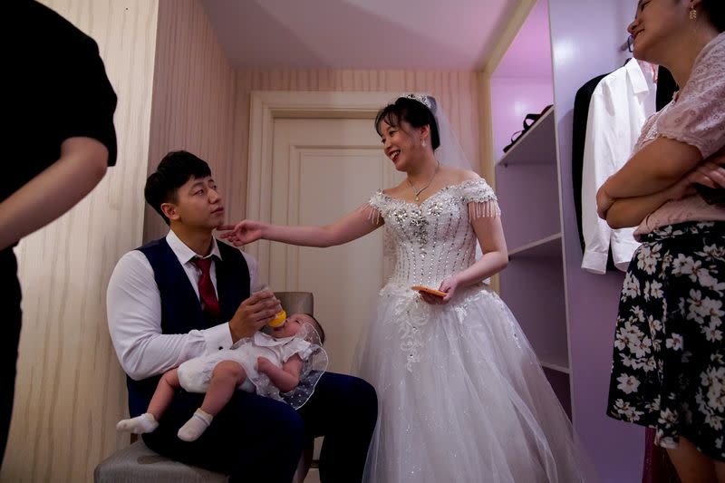 The Wider Image: Coronavirus dampens celebrations in China's wedding gown city