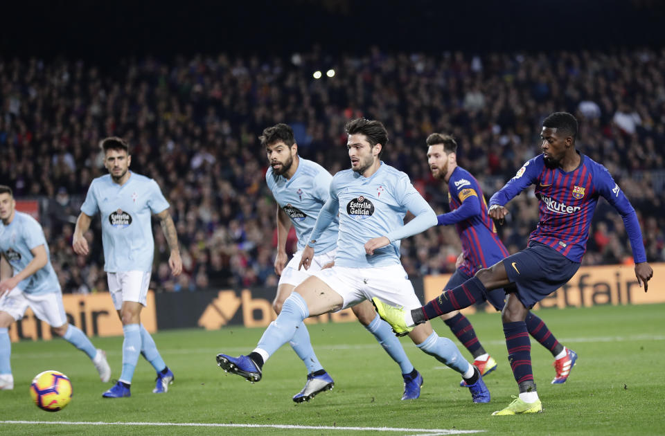 FC Barcelona's Dembele kicks the ball to score during the Spanish La Liga soccer match between FC Barcelona and Celta Vigo at the Camp Nou stadium in Barcelona, Spain, Saturday, Dec. 22, 2018. (AP Photo/Manu Fernandez)