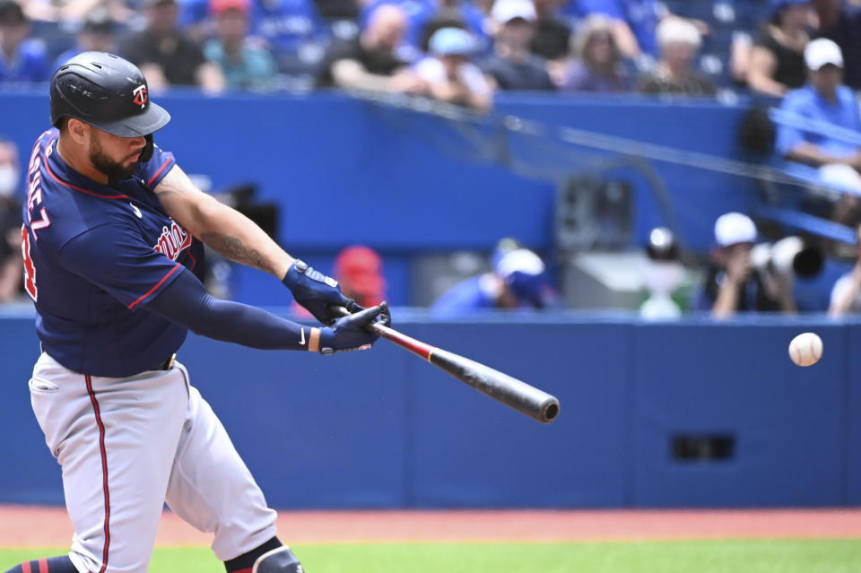 Minnesota Twins' Gary Sanchez hits a single against the Toronto Blue Jays in the first inning of a baseball game in Toronto, Sunday, June 5, 2022. (Jon Blacker/The Canadian Press via AP)